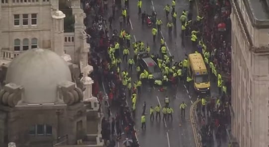 a large group of people in yellow vests and yellow vests