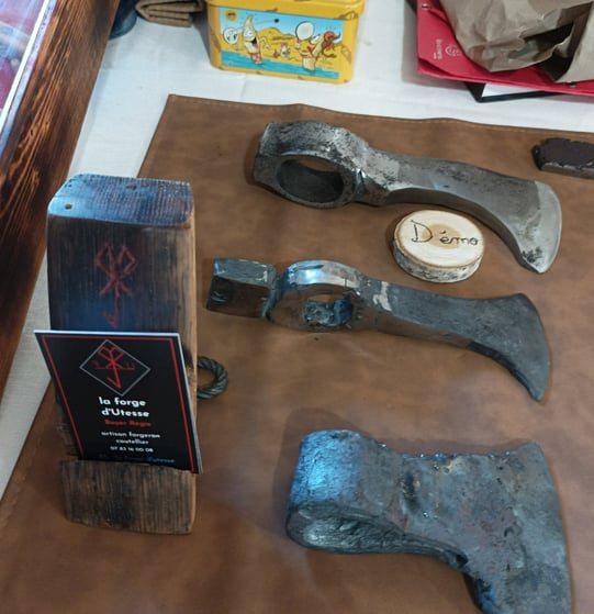 The three final stages of forging an axe head
