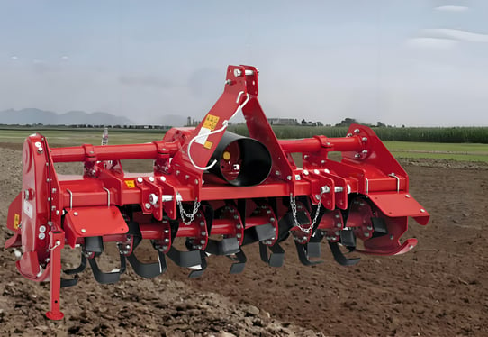 a red tractor with a red disc disc on it