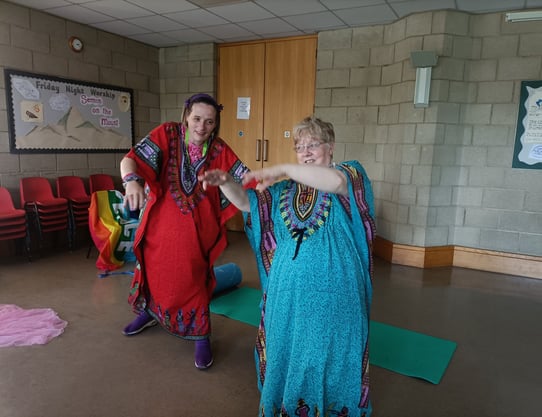 Two people performing a creative dance