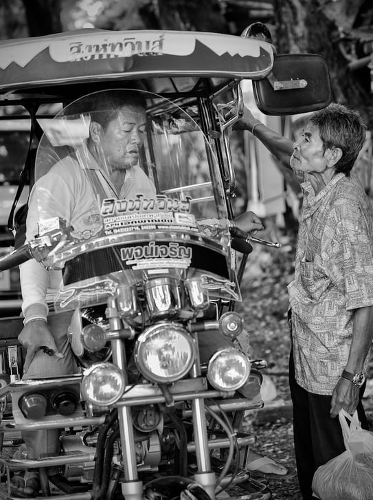 Negotiating a tuk-tuk ride in Thailand, spotted by Peter Pickering