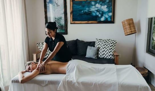 a woman getting a massage at a spa