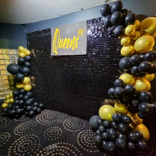 Black shimmer wall with balloon garland for the happening night club in Brisbane.