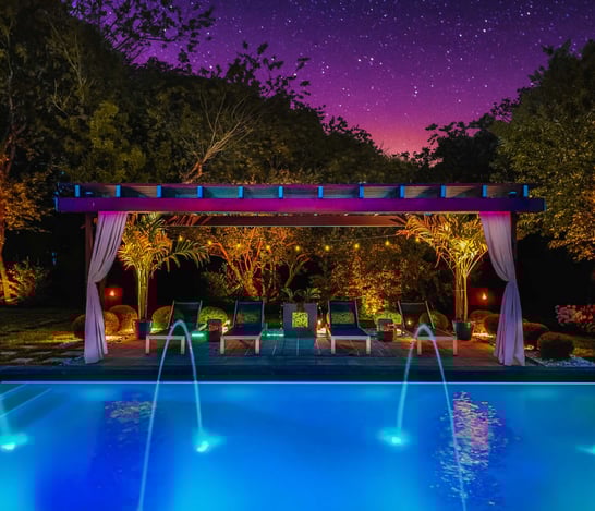 Pergola at night by the pool Houston Custom Enclosures