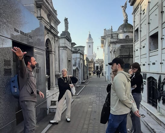 Esteban guiding a small group through Recoleta Cemetery on an English-speaking tour