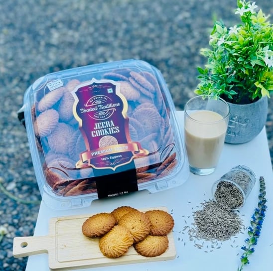 a container of cookies and a glass of tea, Jeera(Cumin) Cookies