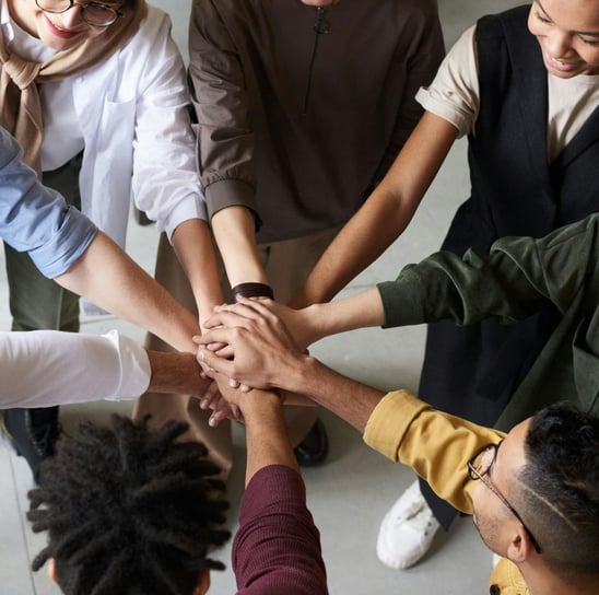 Team putting hands together