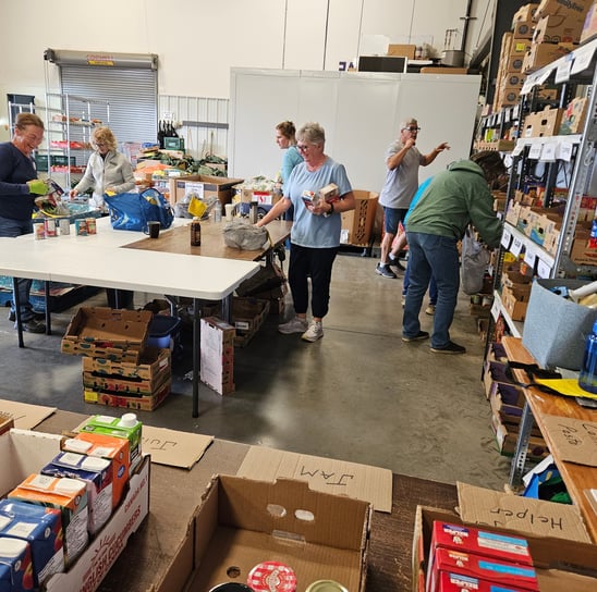 Fort Saskatchewan Food Bank volunteers sort donated food