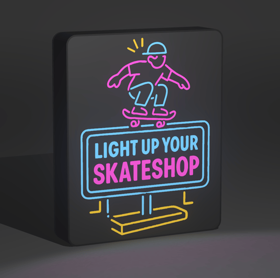 Close-up of a 3D-printed lightbox featuring a bold skate graphic and warm LED lighting.