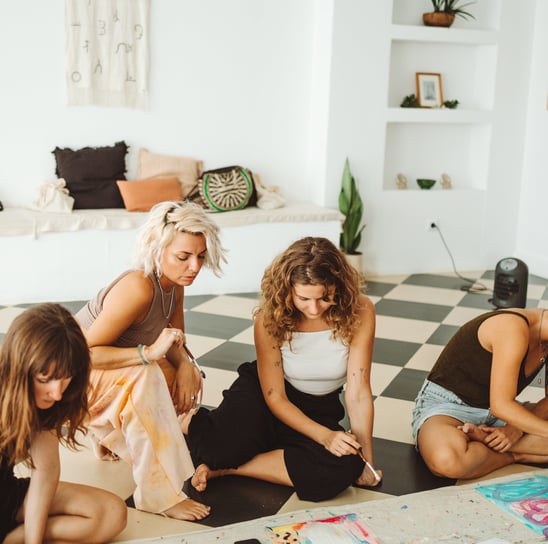 a group of women painting