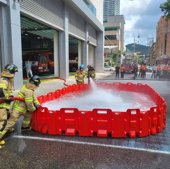 a firefighter is using a hose to put out the hose