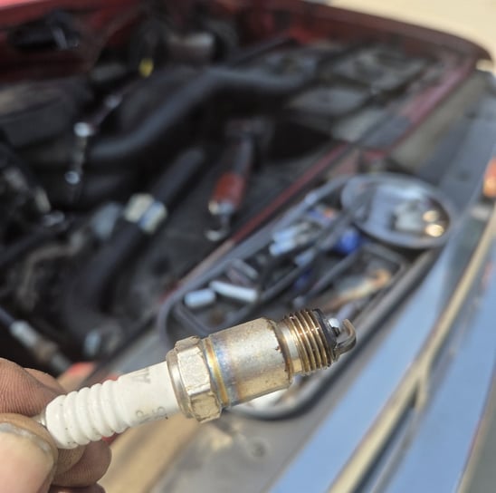 Spark plug that was removed from a 1992 Ford F150 by Fast T's Auto Technician in Waukee Iowa 50263