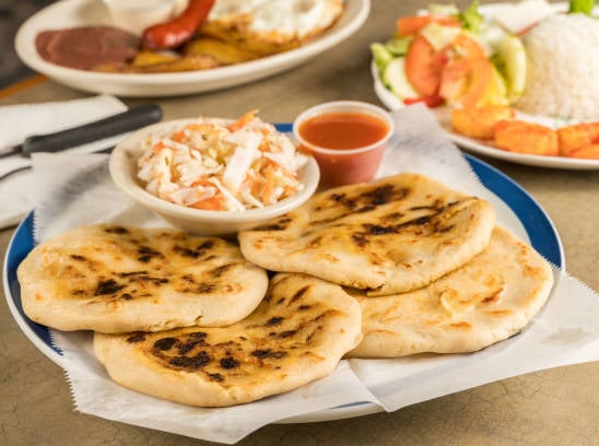 Plate of pupusas with sides