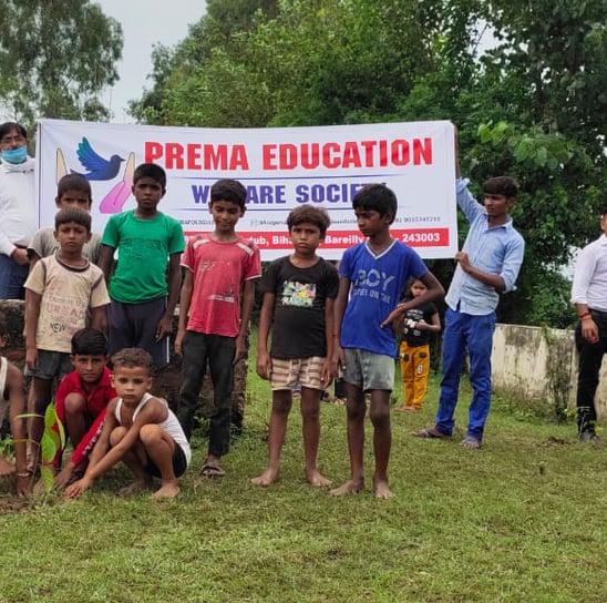 a group of children helping in tree plantation drive