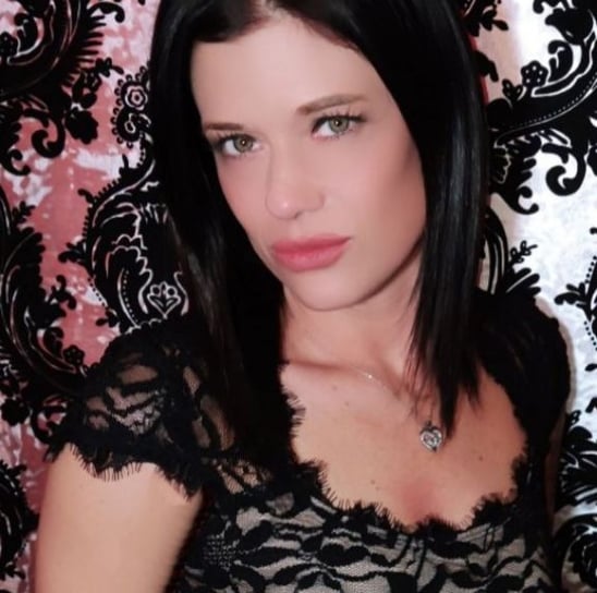 a woman Harley Brooks in a black dress with a black lace top