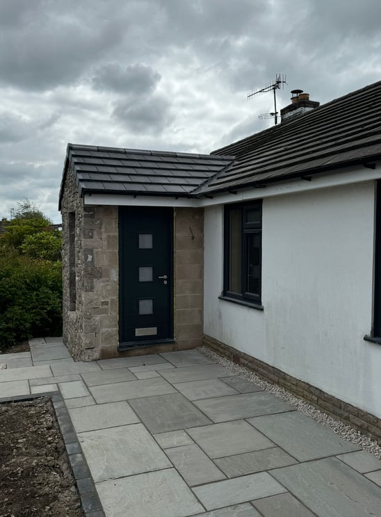 a house with a black door and a black door