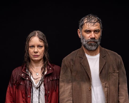 a man and woman standing next to each other