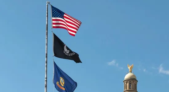 American flag raised above the capital building in Boise Idaho