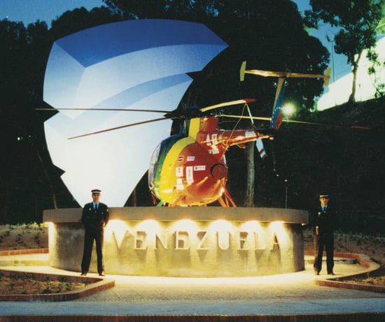 a helicopter that is sitting on a concrete wall