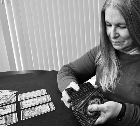 woman reading tarot cards