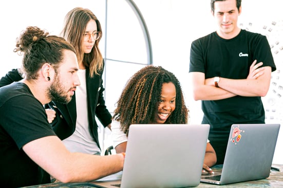 a group of people sitting around a table discussing on how to execute the work