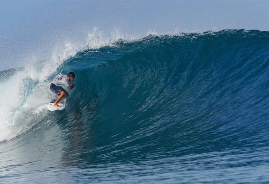 Surfer getting barreled at an Afulu Wave