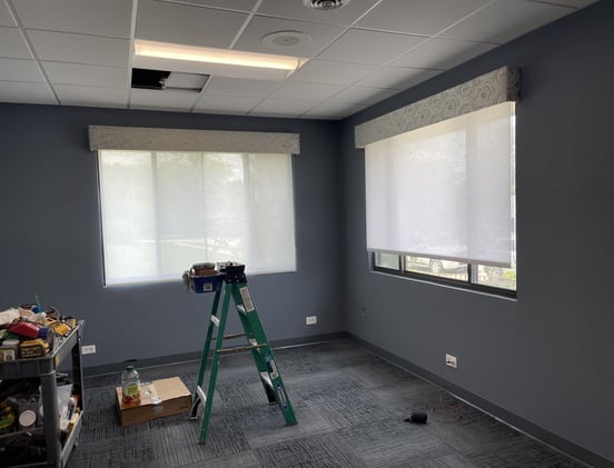 in progress office renovation with new shades and modern carpet design