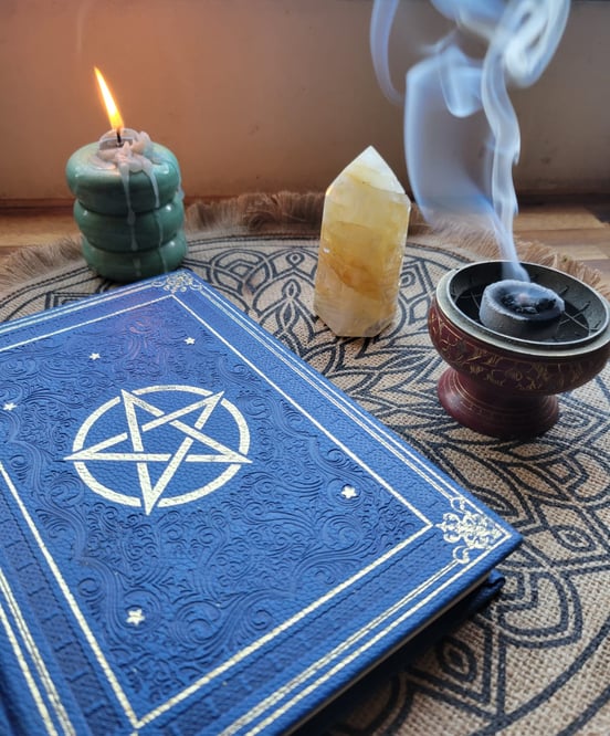 a pentagramble with a pentagram and a candle