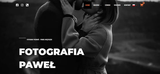 a man and woman kissing in front of a camera