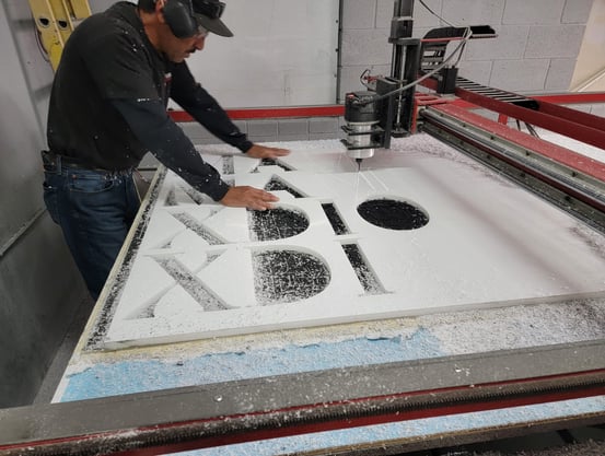 One of our employees working on one of our signs
