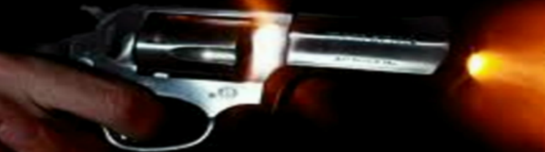 a person holding a gun in their hand