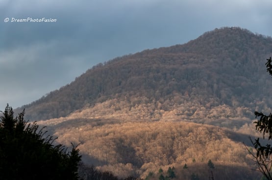 a mountain scene with a mountain in the background
