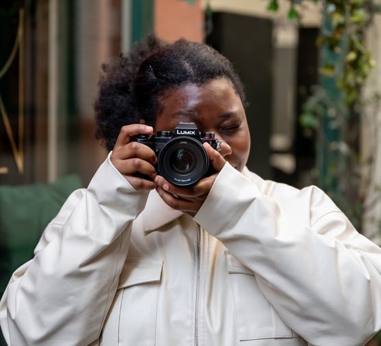 a black woman taking a self portrait of herself