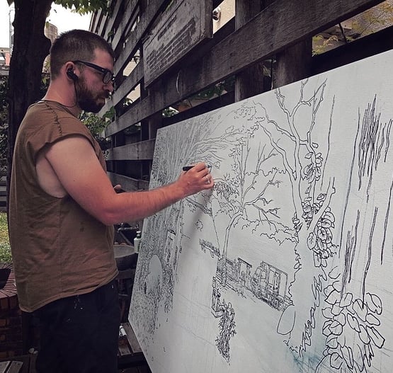 artist Evgeny Bondarenko sketching mural in Taiwan