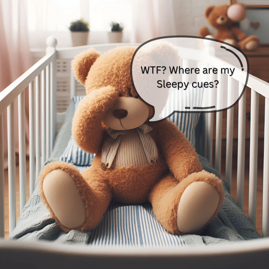 Tired teddy bear in a cot