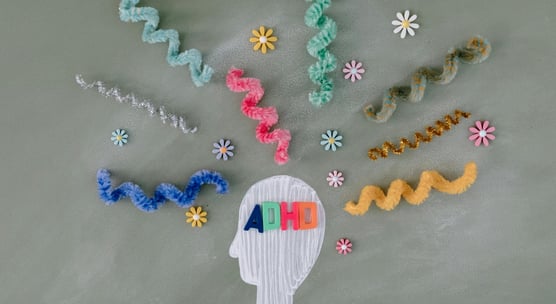 a chalkboard with a picture of a human head and a number of letters on