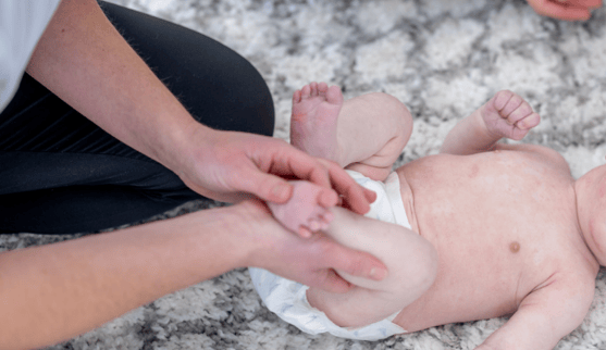 a baby receiving physiotherapy at early stage