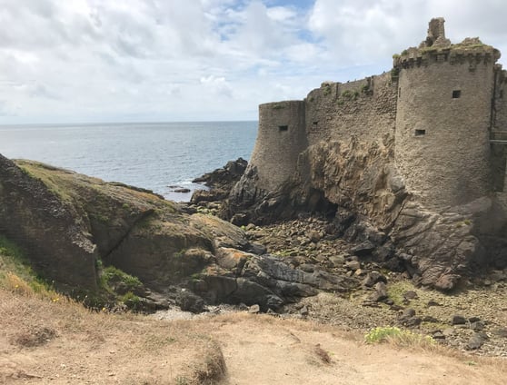 a castle like structure with a large stone wall