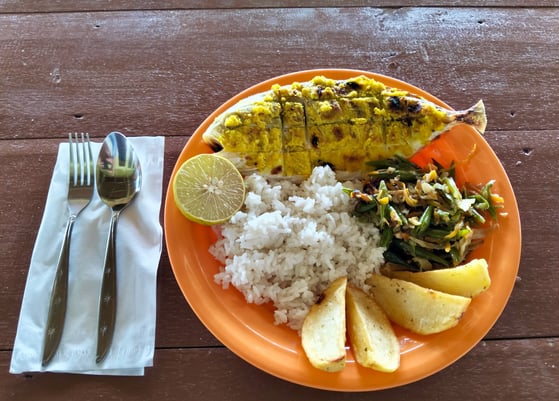 Delicious Indonesian style cuisine at Afulu Surf Resort featuring fish and chicken.