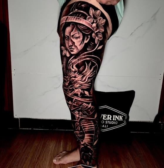 tattoo on tourist’s calf at Legian tattoo studio