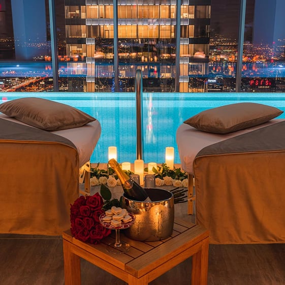 a couple of chairs with candles and candles