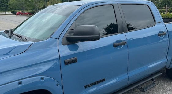 A truck with windows tinted from D and P auto detailing