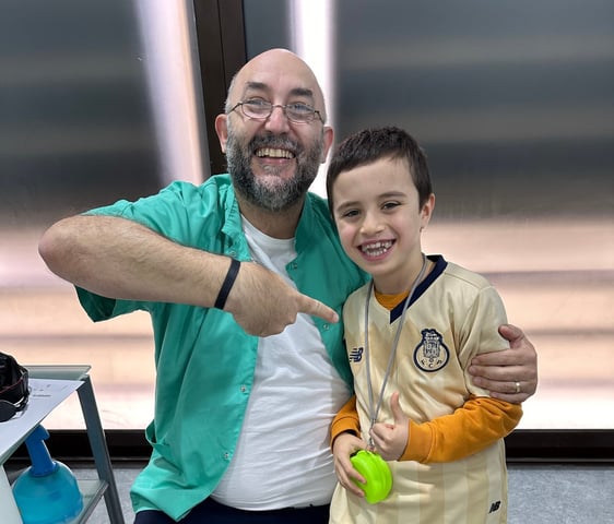 a man and a boy are posing for a picture