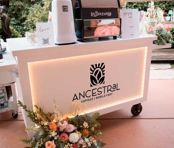 Full view of Ancestral on Wheels espresso cart with custom branding for events