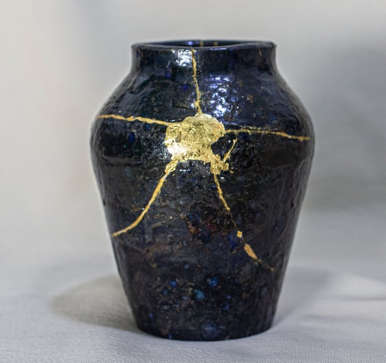 Kintsugi-repaired vase with 24K gold veins, handmade in Amman, Jordan