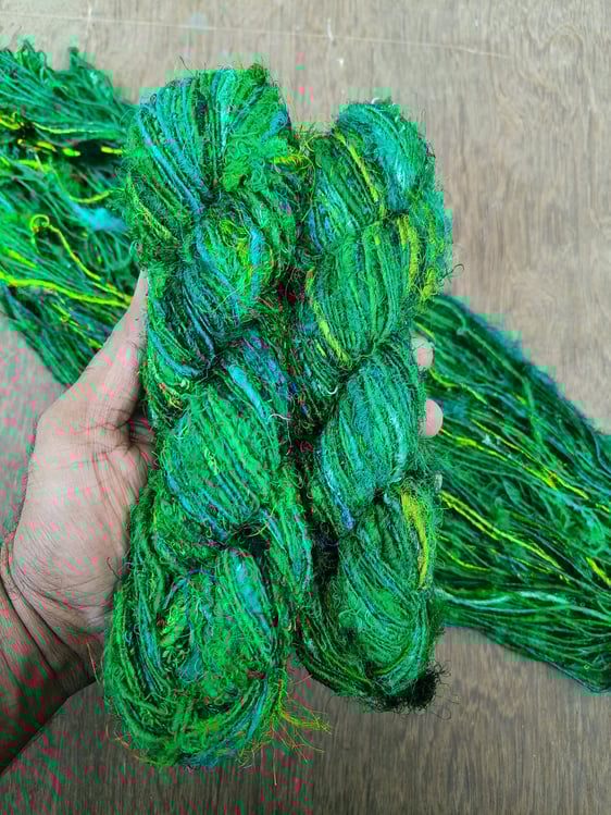 Our Premium Sari Silk Handspun Yarn is vibrant, exotic and made from 100% recycled sari silk remnant