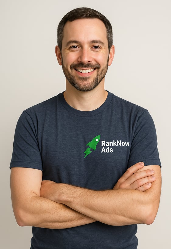 Portrait of Marvin from RankNow Ads, smiling confidently in a navy blue t-shirt with the RankNow Ads