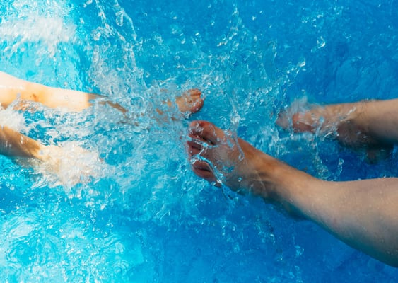 feet splashing in water