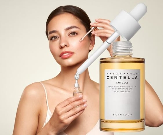 Woman putting Centella Asiatica (Cica) on her face