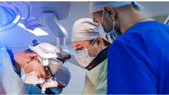 a group of surgeons performing surgery in a hospital